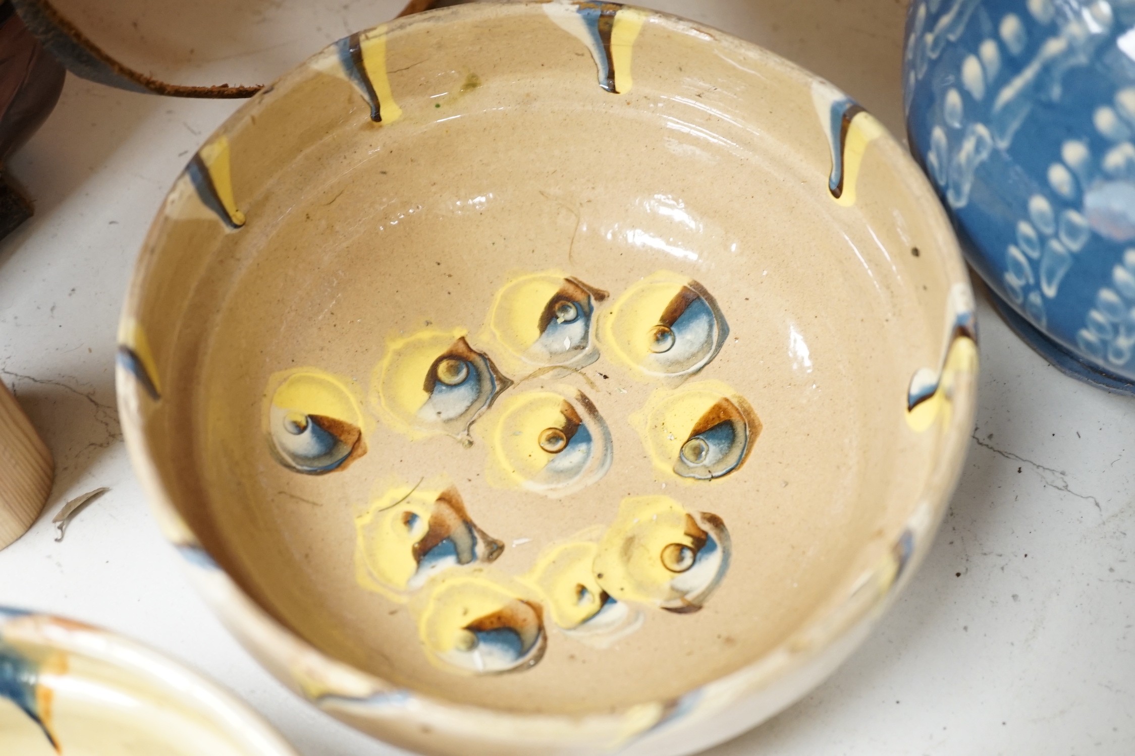 A set of six French provincial pottery bowls and a similar jug